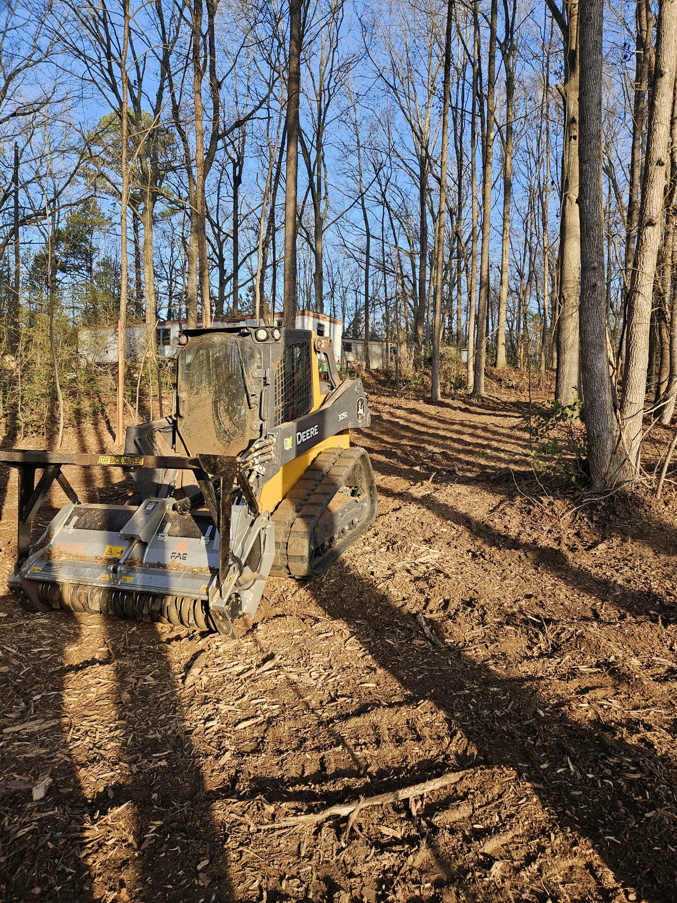 John Deere 325G forestry mulcher on completed 1.5 acre job site in Greer SC by Fisher's Forestry and Land Management